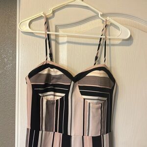 Flowy pant romper. Has slits in the legs for flowy dress look.